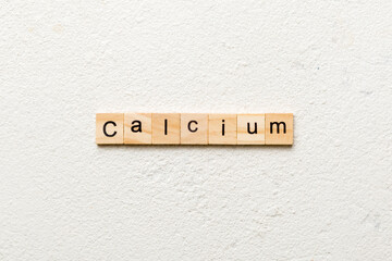 CALCIUM word written on wood block. CALCIUM text on cement table for your desing, concept