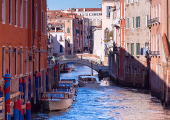 Venice. Old medieval houses over a canal on a clear day.