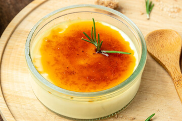 French Creme Brulee on a wooden background, Restaurant menu, dieting, cookbook recipe top view