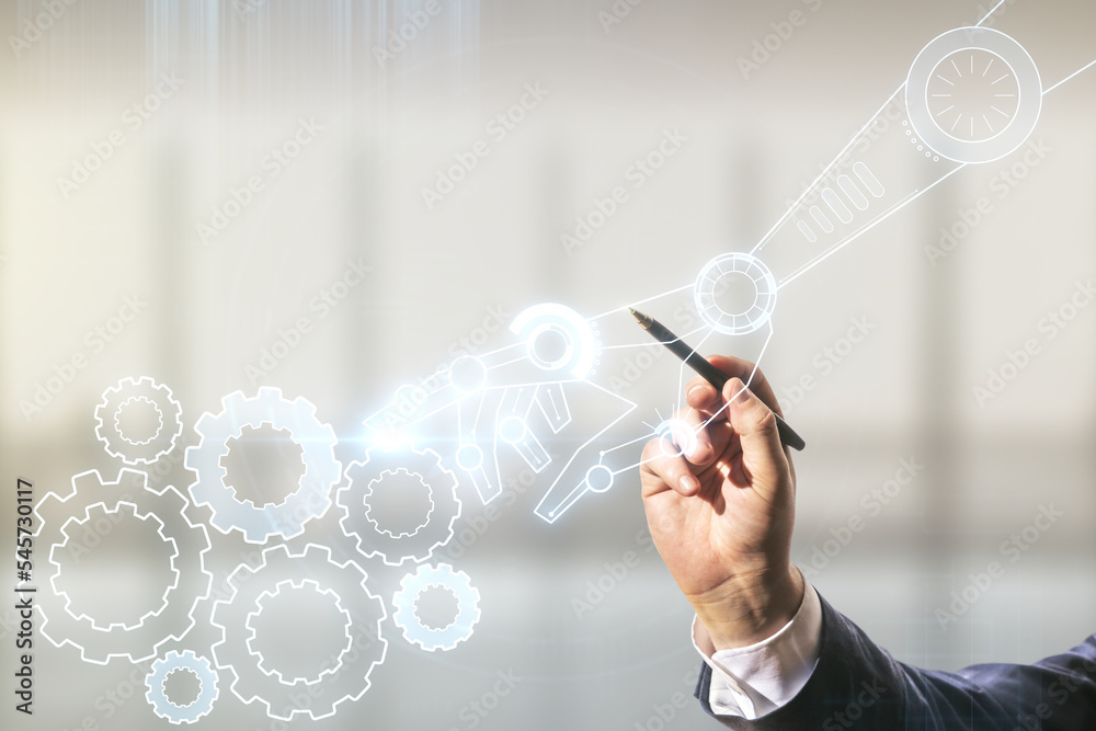 Leinwandbilder man hand with pen draws abstract virtual robotics technology hologram on blurred office background, 