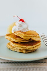 Vertical shot of Multigrain Pancakes with cherry