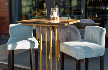 Restaurant interior tables near a restaurant. Close up shot of empty cafeteria or restaurant tables with chairs on street