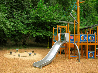 Children's playground in the park with a slide. 
