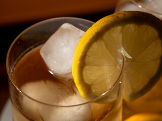Iced tea in a glass with ice cubes. Cold tea with ice.