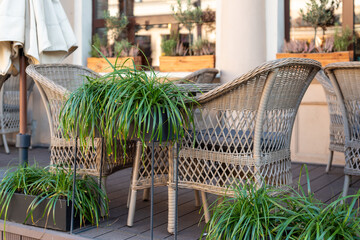 Restaurant interior tables near a restaurant. Close up shot of empty cafeteria or restaurant tables with chairs on street