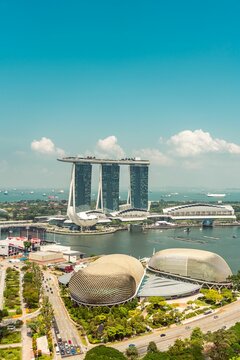 Vertical shot of Marina Bay Sands hotel and the bay in Singapoe in blue sky background