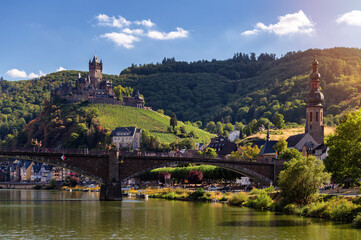 Fototapeta na wymiar Cochem, Germany, beautiful historical town on romantic Moselle river, city view with Reichsburg castle on a hill in autumn color