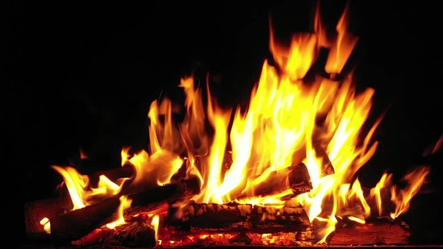 Firewood is burning in the fireplace