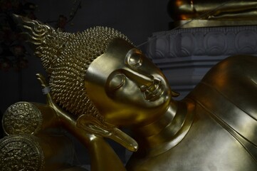 Closeup shot of details on the Reclining Golden Buddha Statue in Bangkok