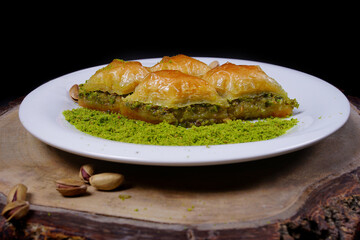 Gaziantep baklava with pistachio and pistachio. Ground pistachio with side