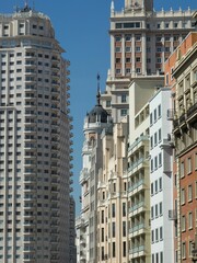 Fototapeta na wymiar Beautiful view of the buildings on Calle Gran Via street in Madrid, Spain.