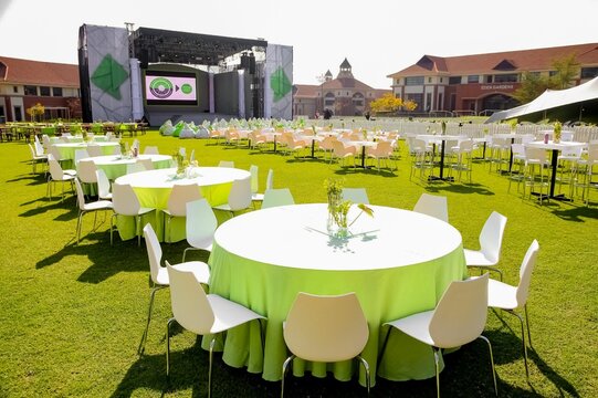 Simple Furnished Outdoor Corporate Event Venue With A Stage On A Sunny Day In Johannesburg