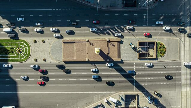 Slow turning shot above of road with moving cars.