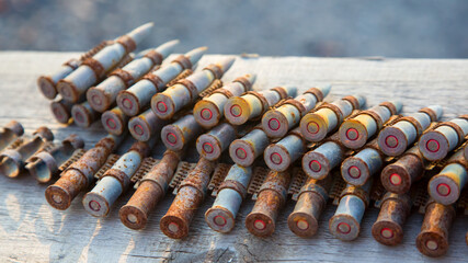 old rusty cartridges in a machine-gun belt. war in Ukraine. military ammunition