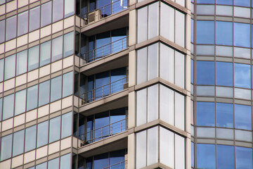 Fototapeta premium Balconies on a glass tall building closeup