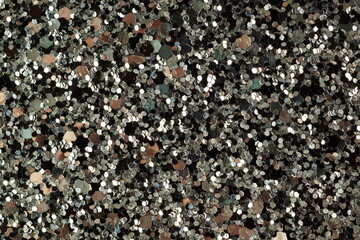 shiny glitter texture on dark background close-up