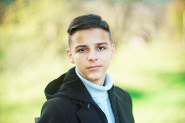 portrait of handsome young man outdoors