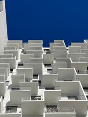 Low angle shot of a modern residential building with stunning geometric facade