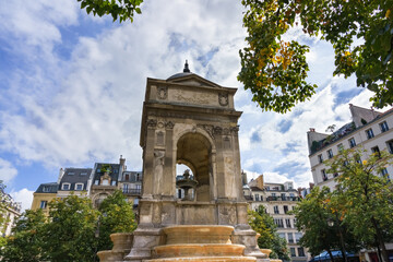 Fototapeta na wymiar The Fontaine des Innocents is a monumental public fountain located 1st district of Paris, France, masterpiece of French Renaissance listed Historical Monument in 1862.