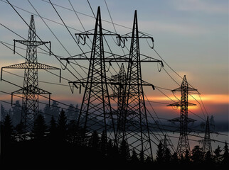 electric towers group under sunset dark clouds