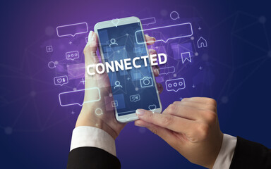 Hand using smartphone with social media concept
