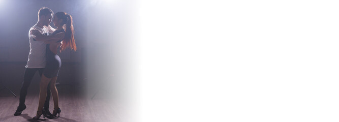 Young love couple dancing social dance kizomba or bachata salsa tango