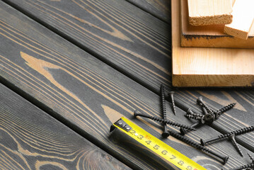 Meter and wooden bars on the carpenter workbench background with copy space.