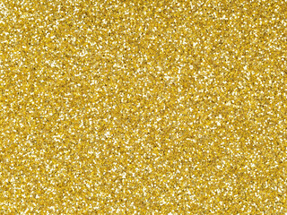 Gold glitter. Perfect holographic background or pattern of sparkling shiny glitter for decoration and design of Christmas, New Year, Valentine Day, xmas gift card or other holiday pictures.
