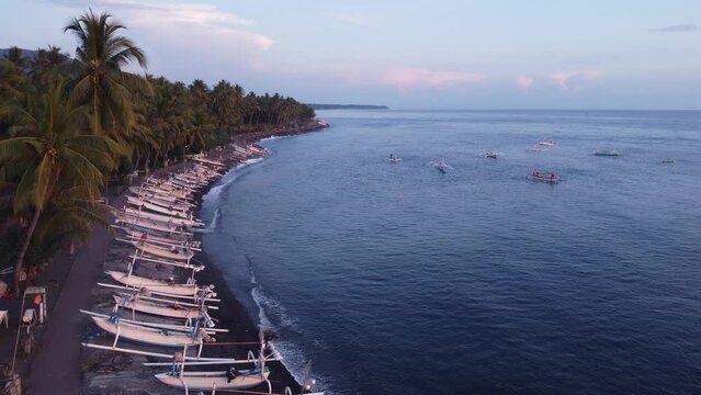 Aerial Morning Sunrise in on the beach in north Bali Indonesia - Sun, Sea and Boats