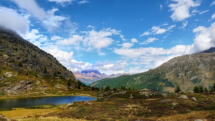 Fototapeta na wymiar Switzerland Simplon Pass with See and Alps and Glacier