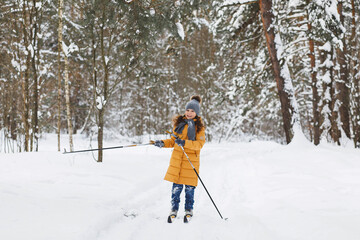 Girl skiing in the forest