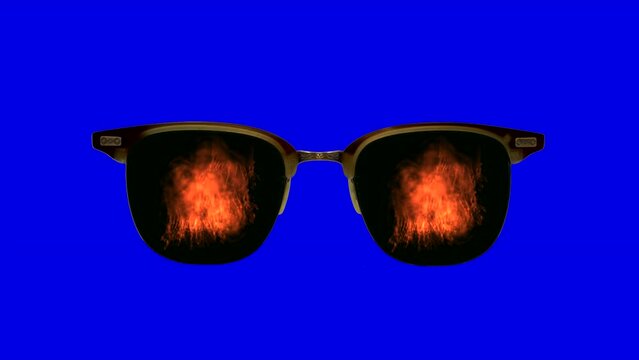 Sunglasses with reflection of explosion and flame on blue screen. Chroma Key and blue screen