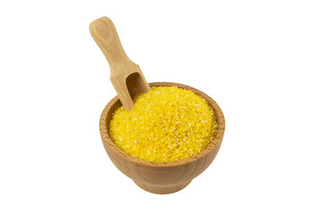 corn grits  in wooden bowl and scoop isolated on white background. nutrition. food ingredient.