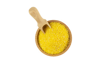corn grits  in wooden bowl and scoop isolated on white background. nutrition. food ingredient.