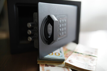 money in a residential safe close-up photo. Deposit in cash. Russian rubles are in the safe