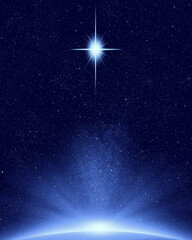 Christmas star above planet earth in night sky with stars - 545764389