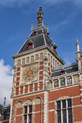 Architectural fragments of historic building of Amsterdam central railway station (opened in 1889). Amsterdam, the Netherlands.