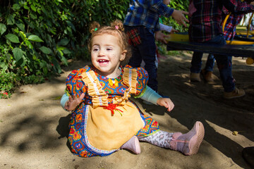 Baby girl smiling dressed in festa junina outfit, traditional feast of sao john in northeastern brazil