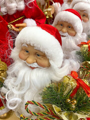 Lots of Santas in red hubcaps. Christmas toys. Postcard. Showcase of Christmas 