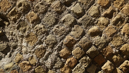 Detail of a wall in a Roman structure built with the opus reticulatum technique in blocks of...