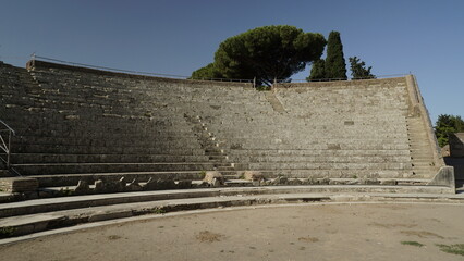 Ostia Antica, Rome, Italy - July 02, 2022, detail of the steps of the Roman Theater seen from the...