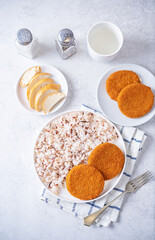 Fresh prepared fish cutlets with rice