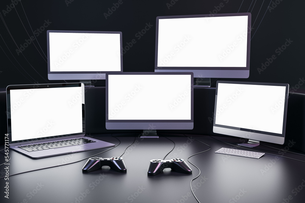 Poster Streaming videogames and gaming concept with blank white glowing modern computer and laptops monitors with place for your text in dark empty room with joysticks on the floor. 3D rendering, mockup