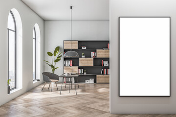 Front view on blank white poster on light grey wall in sunlit cozy home office with arch windows, bookcase on light background and stylish work table. 3D rendering, mockup