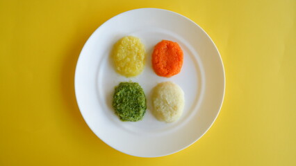 baby food vegetable puree shaped on white dish