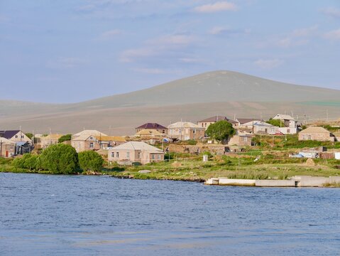 Panoramic view of traditional village at Paravani Lake in Samtskhe-Javakheti National Park, Georgia.