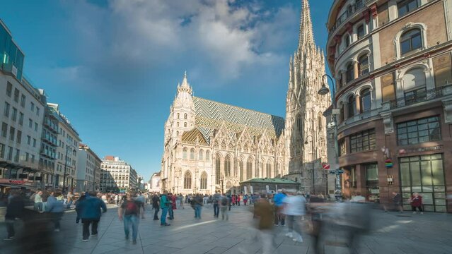 Vienna St. Stephen's Cathedral (Stephansdom) is the mother church of the Roman Catholic Archdiocese of Vienna timelapse, hyperlapse video. People walking on The Stephansplatz square, Austria city.