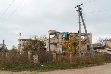 Fototapeta na wymiar Country house destroyed by shelling. War in Ukraine. Russian invasion of Ukraine. Terror of the civilian population. War crimes