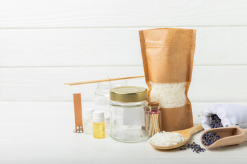 Ecological and vegan handmade soy wax candles with wooden wick. Transparent container, essential oil, soy wax, matches and dried flowers. MOCKUP, space for text. Handmade craft candles.