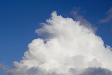 blue sky with big puffy white cloud as a nature background 